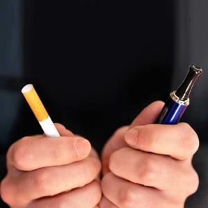 hands holding a cigarette and an electronic cigarette